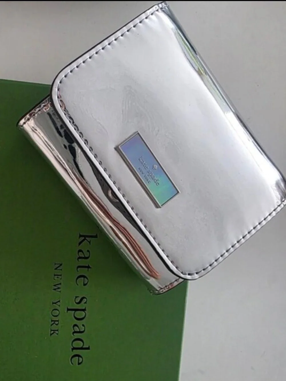 kate spade Silver Metallic Compact Card Wallet with Iridescent Logo Plaque